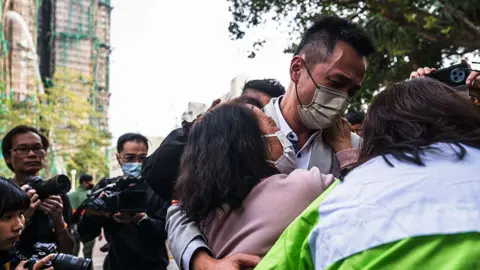 Tragic Consequences of Hong Kong Blaze: Community Faces Agonizing Wait for Missing