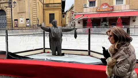 Italian Town's Pavarotti Statue Encased in Ice Rink Sparks Controversy